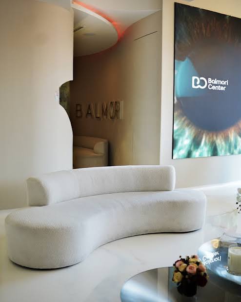 Balmori Center lounge with curved sofa and BALMORI signage